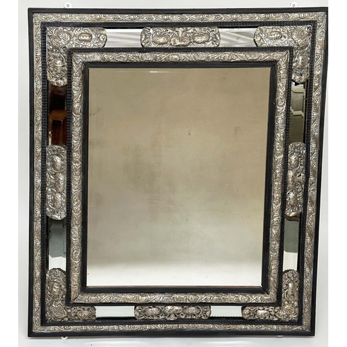 262 - DUTCH WALL MIRROR, 19th century carved ebony and repoussé silver  metal mounted, bevelled mirror wit... 