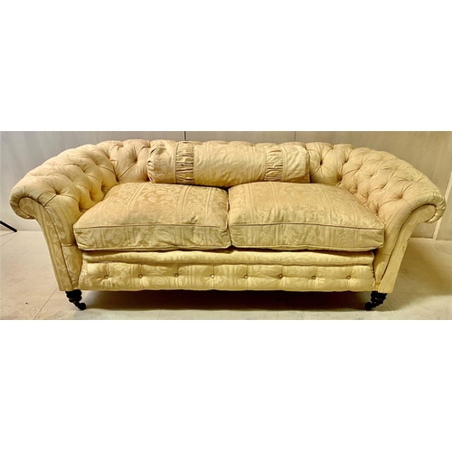 270 - CHESTERFIELD TWO SEATER SOFA, early 20th Century, yellow damask floral patterned upholstery, deep bu... 