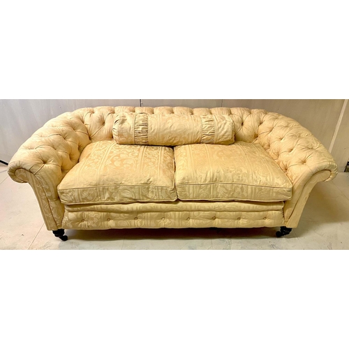 270 - CHESTERFIELD TWO SEATER SOFA, early 20th Century, yellow damask floral patterned upholstery, deep bu... 