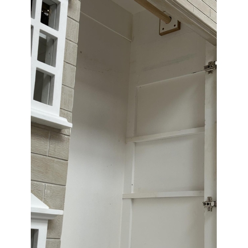 397 - DOLLS HOUSE WARDROBE, in the form of a Georgian London Townhouse with two doors enclosing hanging sp... 