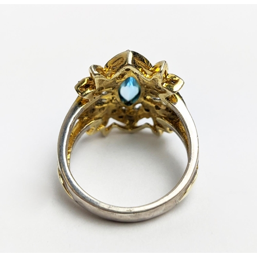 44 - A VICTORIAN STYLE SILVER-GILT TOPAZ DRESS RING, the central stone of 0.30 carats surrounded by tiny ... 