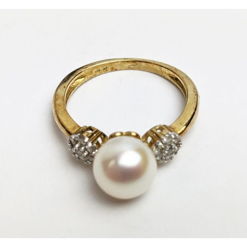 49 - A 9CT GOLD SINGLE CULTURED PEARL SET DRESS RING, with daisy set diamond cluster shoulders, the diamo... 