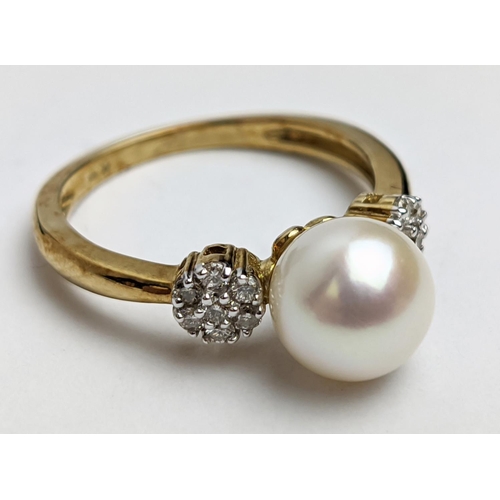 49 - A 9CT GOLD SINGLE CULTURED PEARL SET DRESS RING, with daisy set diamond cluster shoulders, the diamo... 