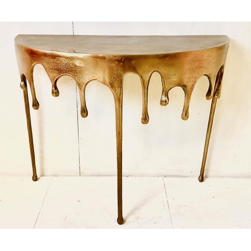DEMILUNE CONSOLE TABLE, 76cm high, 90cm wide, 34cm deep, abstract dripping design gilt finish metal.