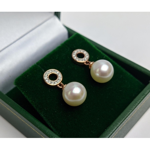 50 - A PAIR OF 9CT GOLD CULTURED PEARL AND DIAMOND DROP EARRINGS, the pearls of 8mm diameter, complete wi... 