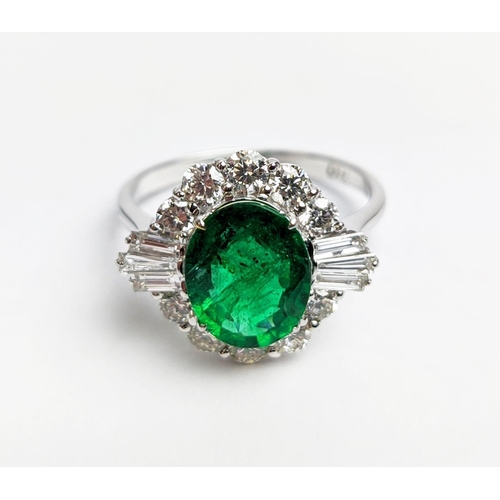 51 - AN 18CT WHITE GOLD EMERALD AND DIAMOND CLUSTER RING, the oval stone of approx. 1.89 carats, surround... 