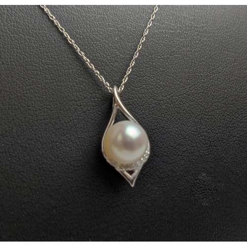 53 - A 9CT WHITE GOLD AND PEARL AND DIAMOND PENDANT NECKLACE, with a single row of diamonds below the pea... 