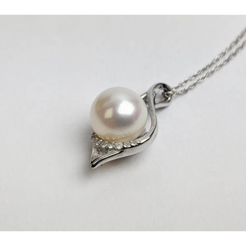 53 - A 9CT WHITE GOLD AND PEARL AND DIAMOND PENDANT NECKLACE, with a single row of diamonds below the pea... 