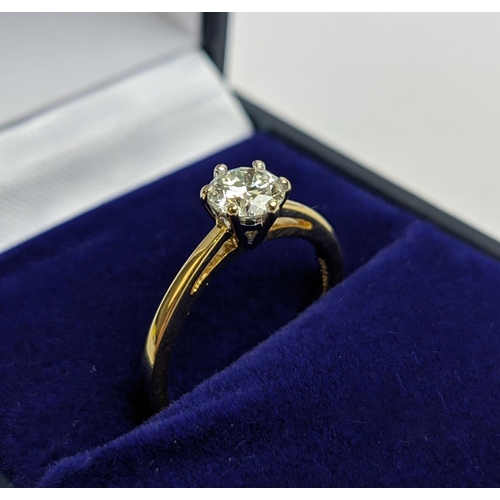 54 - AN 18CT GOLD DIAMOND SOLITAIRE RING, the claw set round brilliant cut stone of approximate diamond w... 