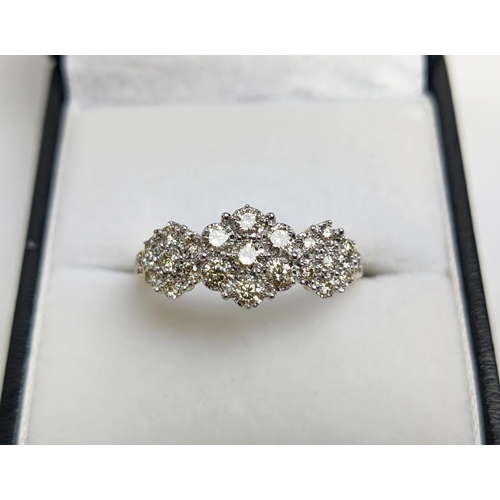 55 - A 9CT YELLOW GOLD DIAMOND CLUSTER DRESS RING, set with three clusters of seven diamonds, total diamo... 