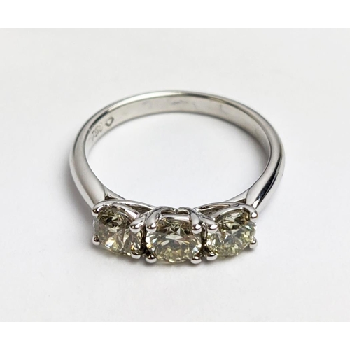 56 - AN 18CT WHITE GOLD THREE STONE DIAMOND TRILOGY RING, the claw set round brilliant cut stones of appr... 