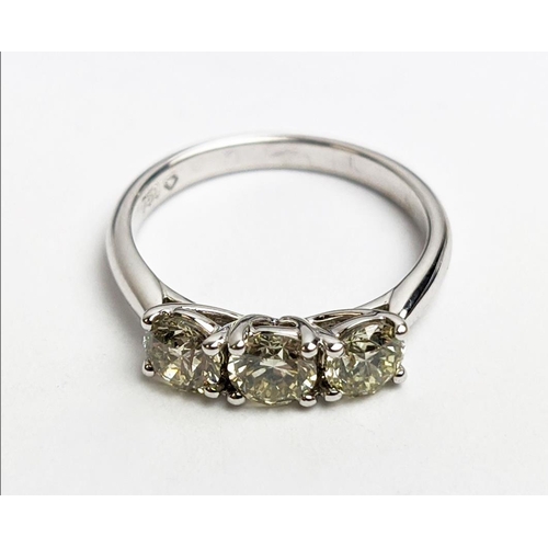 56 - AN 18CT WHITE GOLD THREE STONE DIAMOND TRILOGY RING, the claw set round brilliant cut stones of appr... 