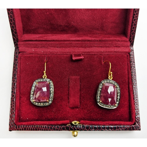 59 - A PAIR OF RUBY AND DIAMOND DROP EARRINGS, the large central stones with an approximate weight of 4.9... 