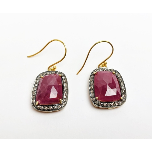 59 - A PAIR OF RUBY AND DIAMOND DROP EARRINGS, the large central stones with an approximate weight of 4.9... 