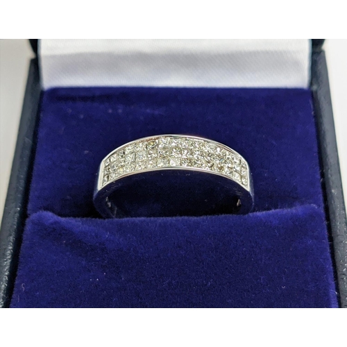 62 - AN 18CT WHITE GOLD DIAMOND RING, with 45 invisible set princess cut diamonds in three rows, total di... 