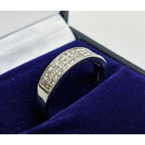 62 - AN 18CT WHITE GOLD DIAMOND RING, with 45 invisible set princess cut diamonds in three rows, total di... 