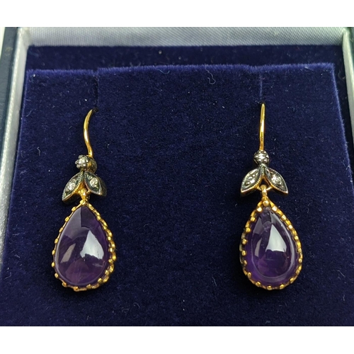 63 - A PAIR OF 9CT GOLD AMETHYST AND DIAMOND DROP EARRINGS, each with a pear shaped amethyst cabochon in ... 