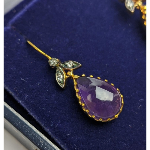 63 - A PAIR OF 9CT GOLD AMETHYST AND DIAMOND DROP EARRINGS, each with a pear shaped amethyst cabochon in ... 