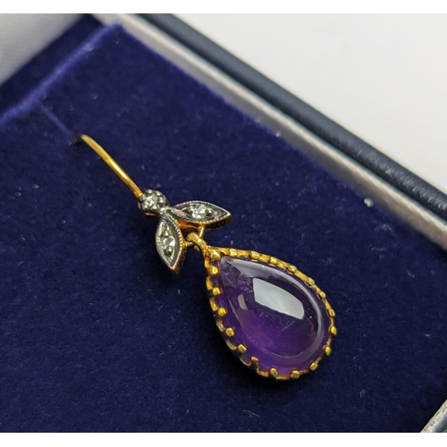 63 - A PAIR OF 9CT GOLD AMETHYST AND DIAMOND DROP EARRINGS, each with a pear shaped amethyst cabochon in ... 