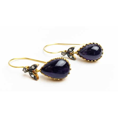 63 - A PAIR OF 9CT GOLD AMETHYST AND DIAMOND DROP EARRINGS, each with a pear shaped amethyst cabochon in ... 