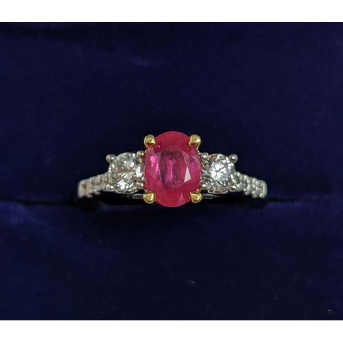 66 - AN 18CT WHITE GOLD RUBY AND DIAMOND TRILOGY RING, the central ruby stone of approx. 0.89 carat, diam... 