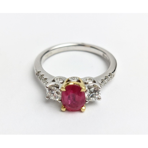 66 - AN 18CT WHITE GOLD RUBY AND DIAMOND TRILOGY RING, the central ruby stone of approx. 0.89 carat, diam... 