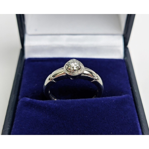 67 - A 9CT WHITE GOLD DIAMOND SOLITAIRE RING, the diamond of approx. 0.25 carat, ring size L, complete wi... 