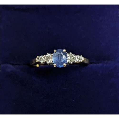 68 - A 9CT YELLOW GOLD SAPPHIRE AND DIAMOND FIVE STONE RING, the central sapphire of 0.50 carat, the diam... 