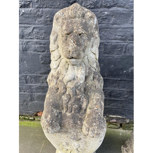 7 - HERALDIC LION STATUES, a pair, well weathered reconstituted stone, 83cm. (2)