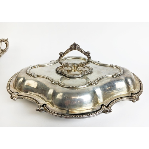 70 - A PAIR OF SILVER PLATED TUREENS AND COVERS, in the Rococo style, plus a pair of warming dishes and t... 