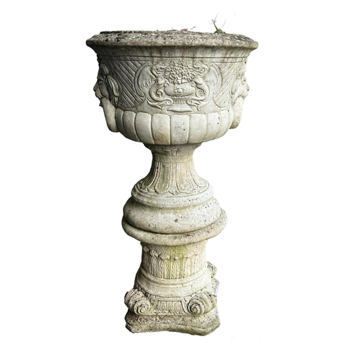 9 - LION HEAD PLANTERS ON STANDS, a pair, well weathered reconstituted stone, 103cm H. (2)