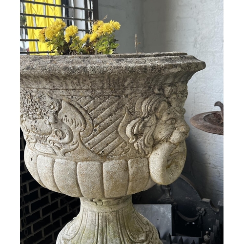 9 - LION HEAD PLANTERS ON STANDS, a pair, well weathered reconstituted stone, 103cm H. (2)