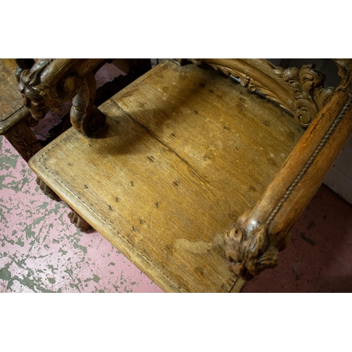 342 - THRONE CHAIRS, a near pair, late 19th century Continental carved oak, tallest 139cm H x 60cm W. (2)