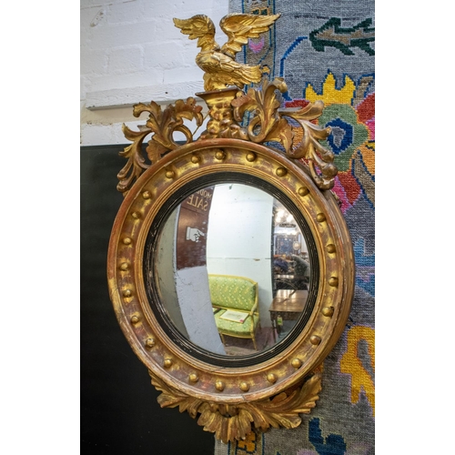 343 - CONVEX MIRROR, 112cm H, Regency giltwood and gesso with foliate and eagle crest.