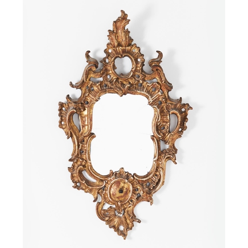 628 - WALL MIRROR, 71cm H x 43cm, Italian giltwood in Rocaille carved frame.