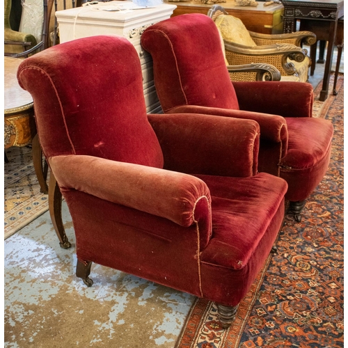 643 - ARMCHAIRS, 94cm H x 86cm W, a pair, late Victorian in old red plush on castors. (2)