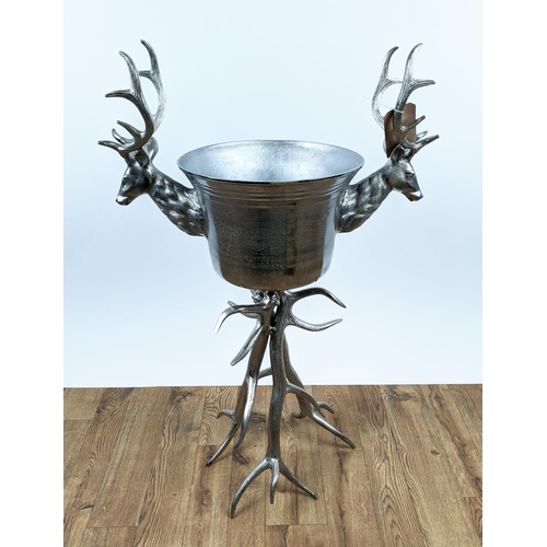 646 - CHAMPAGNE BATH ON STAND, 107cm high, 70cm wide, faux antler design to stand, stag head detail to bat... 