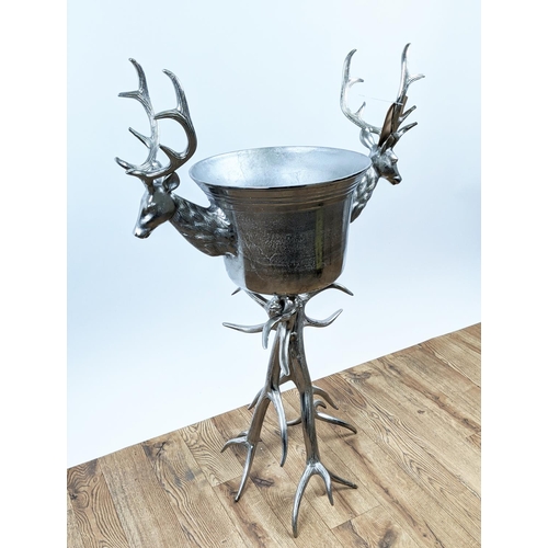 646 - CHAMPAGNE BATH ON STAND, 107cm high, 70cm wide, faux antler design to stand, stag head detail to bat... 