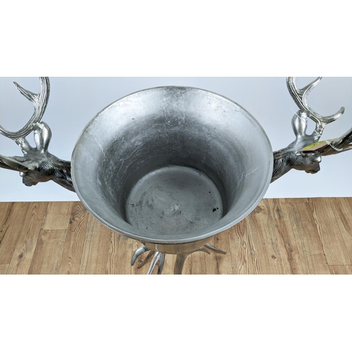 646 - CHAMPAGNE BATH ON STAND, 107cm high, 70cm wide, faux antler design to stand, stag head detail to bat... 