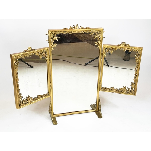 341 - DRESSING MIRROR, late 19th/early 20th century giltwood and metal with triple hinged plates.