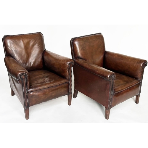 249 - ARMCHAIRS, a pair, early 20th century French with brass studded mid brown natural hide leather and t... 