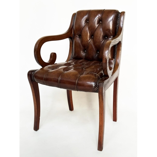 263 - ARMCHAIRS, a pair, Regency style mahogany and brass studded mid brown deep buttoned leather upholste... 