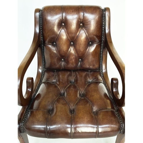 263 - ARMCHAIRS, a pair, Regency style mahogany and brass studded mid brown deep buttoned leather upholste... 