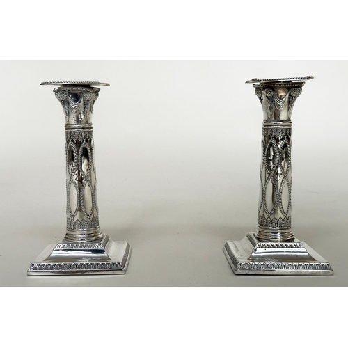 398 - CANDLESTICKS, a pair, George V silver with swag decorated columns and square bases Sheffield 1928 Th... 