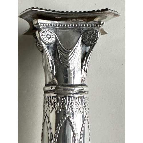 398 - CANDLESTICKS, a pair, George V silver with swag decorated columns and square bases Sheffield 1928 Th... 