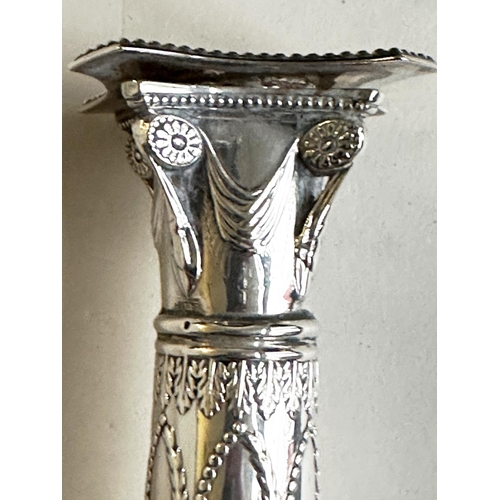 398 - CANDLESTICKS, a pair, George V silver with swag decorated columns and square bases Sheffield 1928 Th... 