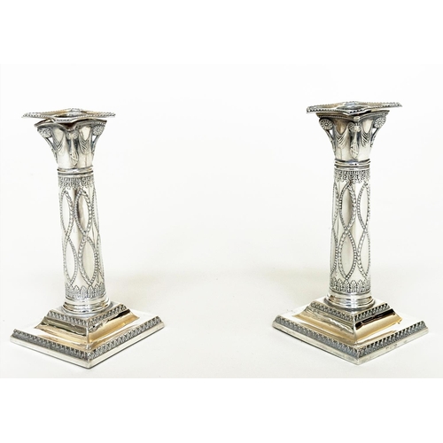 398 - CANDLESTICKS, a pair, George V silver with swag decorated columns and square bases Sheffield 1928 Th... 