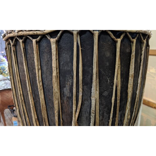 649 - AFRICAN DRUM, 60cm x 147cm H.