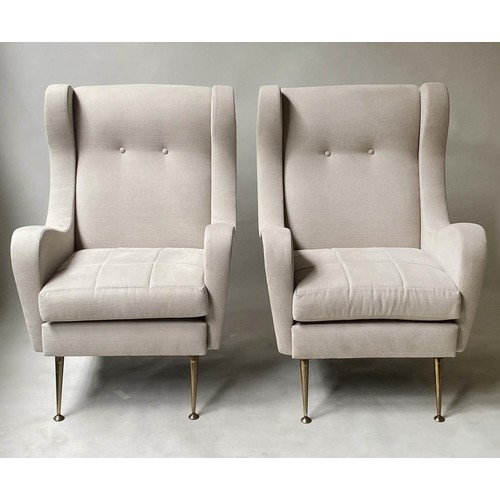 332 - WING ARMCHAIRS, a pair, 1960's style with parchment cotton upholstery and splay gilt metal supports,... 