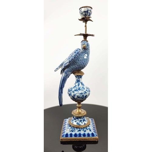 648 - CANDELABRA, 48cm high, a pair, in the form of parrots, blue and white glazed ceramic, gilt mounts. (... 